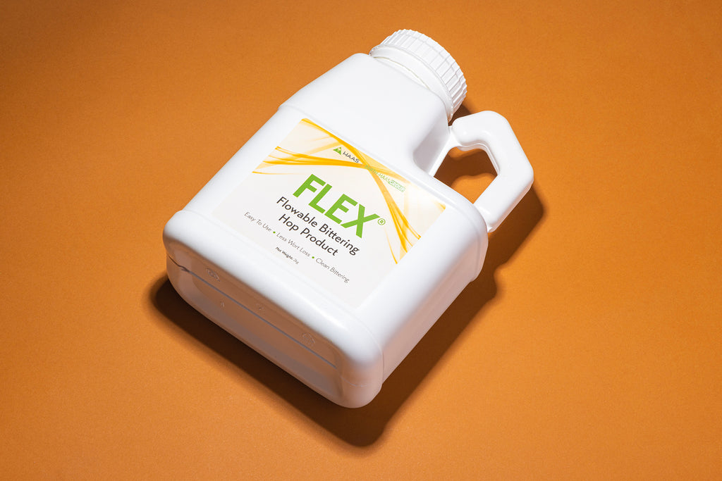 Jug of FLEX liquid hop extract on an orange background